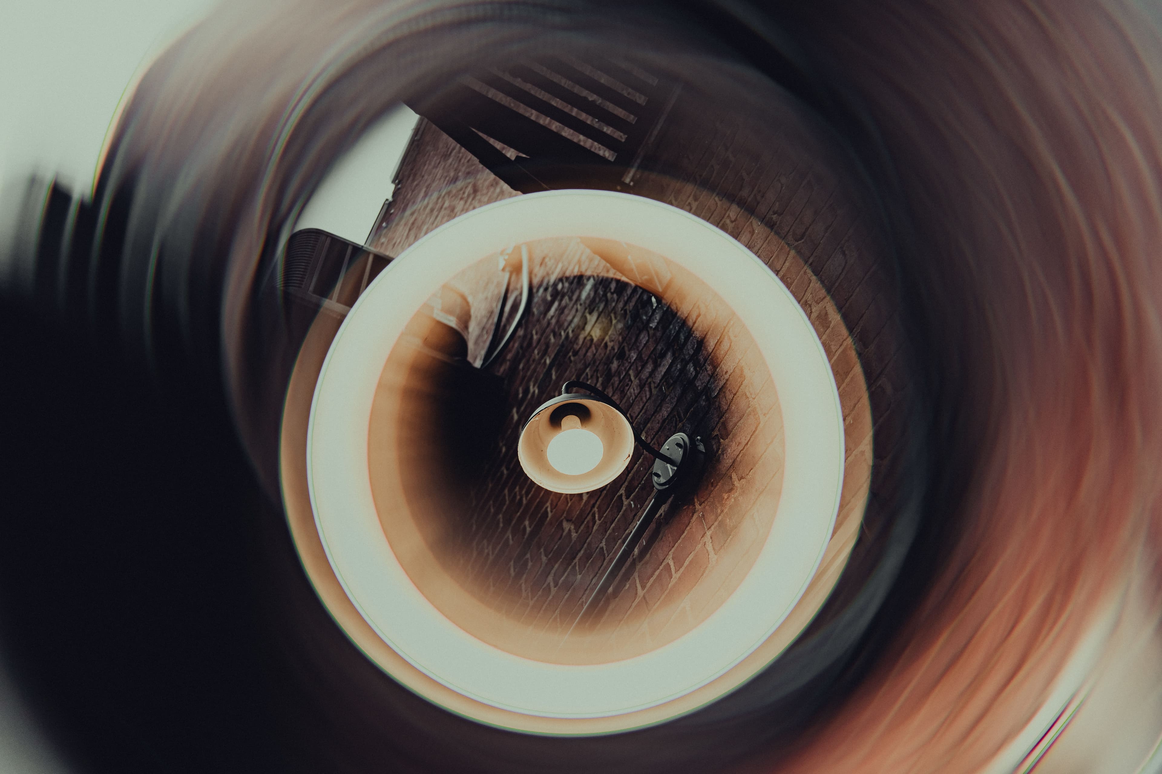 Artistic photo of a ceiling light with swirling abstract effect.